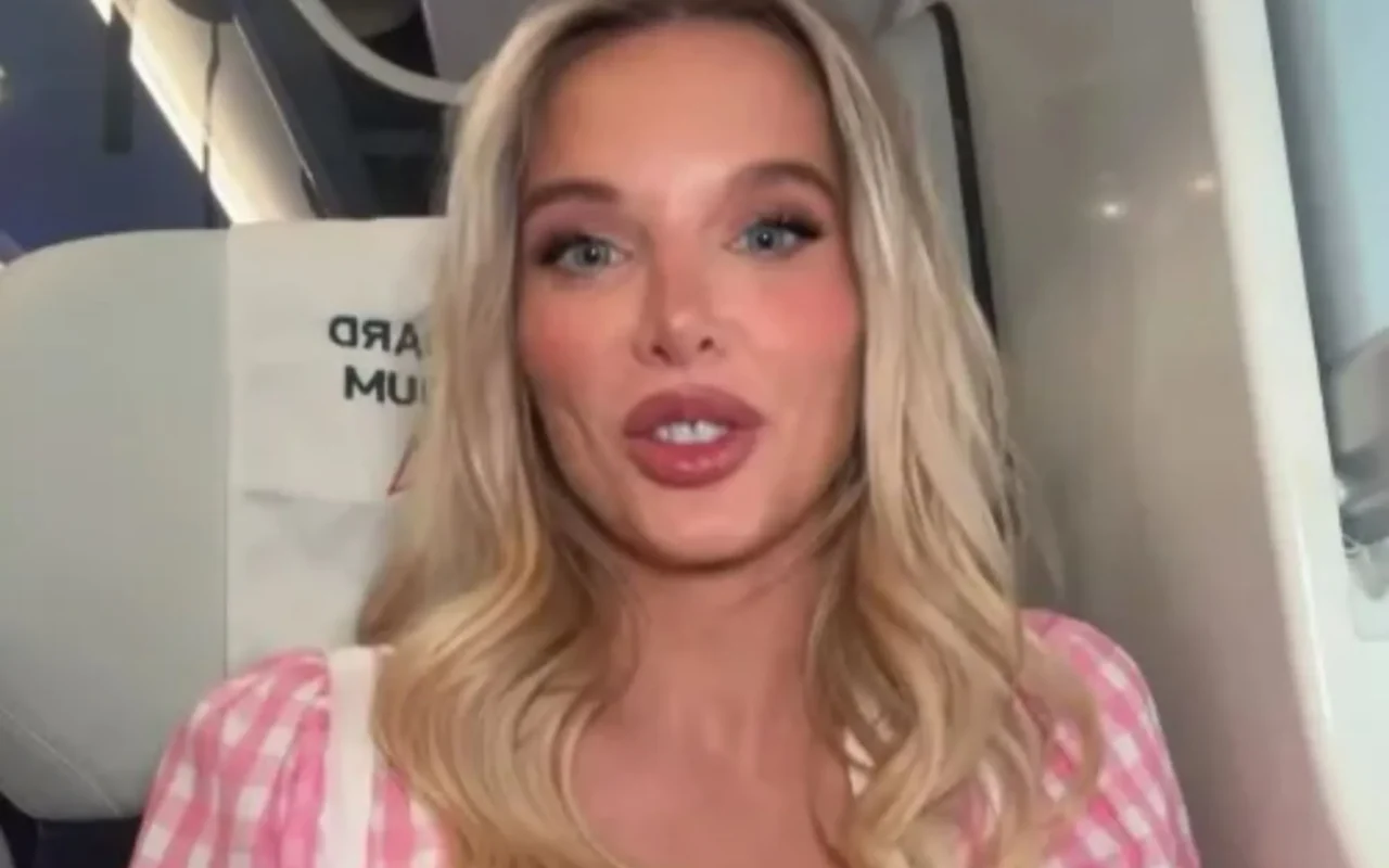 Helen Flanagan looks incredible in plunging pink dress as she battles heatwave on train to London