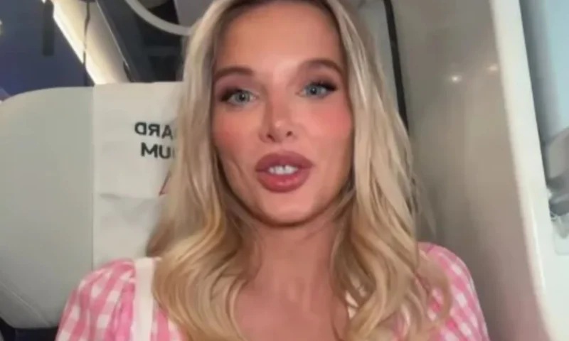 Helen Flanagan looks incredible in plunging pink dress as she battles heatwave on train to London