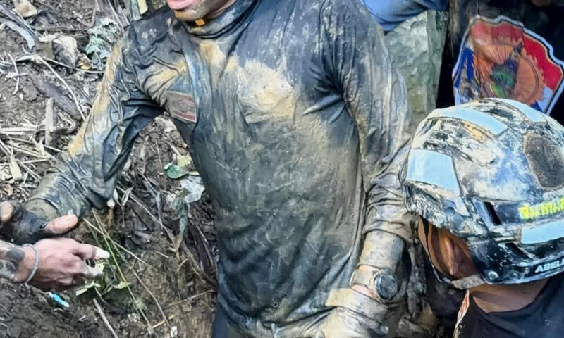 Rescuers work to drain flooded Laos cave to free 5 villagers and search for 2 still missing