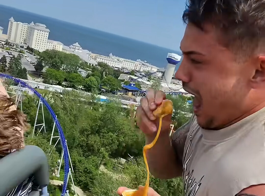 Six Flags bans Cedar Point parkgoer for life after he ate chicken nuggets on roller coaster in viral video