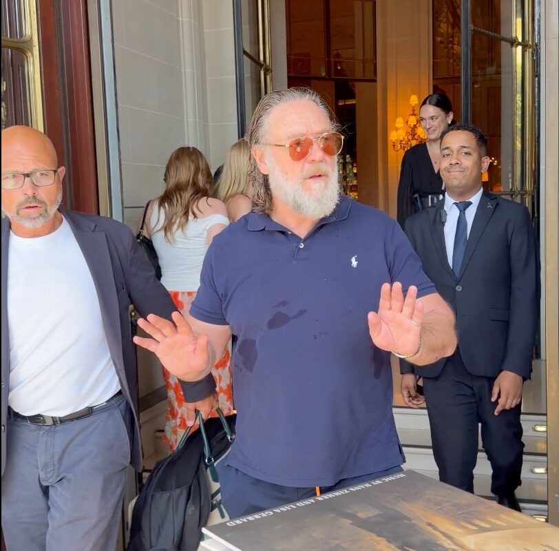 Russell Crowe warns autograph hunters gathered outside his Paris hotel: ‘Don’t f–king push in on me’