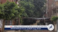 النيابة العامة تعاين موقع انهيار حائط من برج سكني بالمنيا وتصرح بدفن جثمان محفظة القرآن