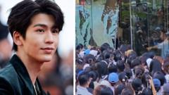 Watch: Glass doors break as fans scramble to see Pursuit of Jade star