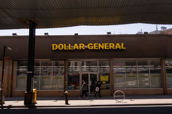 Dollar General is raising its annual profit forecast as bargain hunters flood its stores