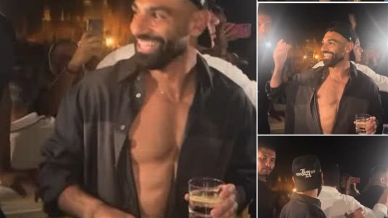 بقميص مفتوح وكاب، محمد صلاح يرقص ويغني على أنغام “ولا أي كلام” لحماقي بالعلمين (فيديو)