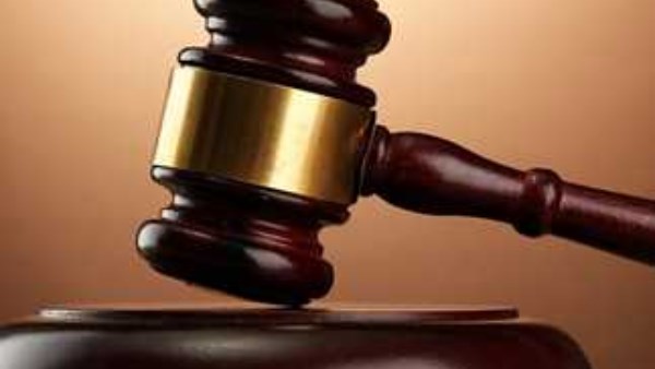 حبس سيدة وزوجها لقيامهما بالترويج لبيع العملات المزيفة على الإنترنت