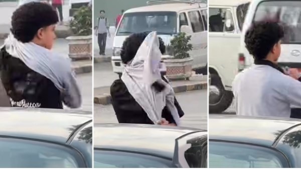 صحى متأخر عن المدرسة.. طالب يبدل ملابسه في الشارع بأول يوم دراسي